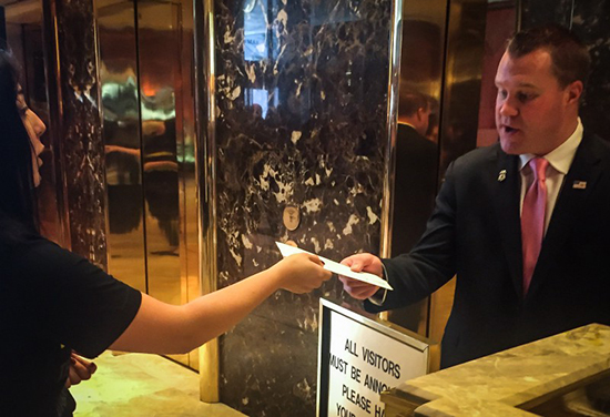 AI USA staff delivering a letter inside Trump Towers NYC