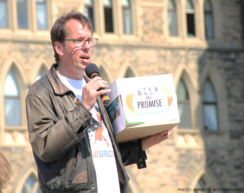 Craig Benjamin of Amnesty International speaks at the Rally for the Peace River