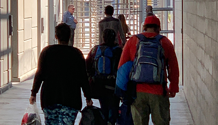 People walk towards the border