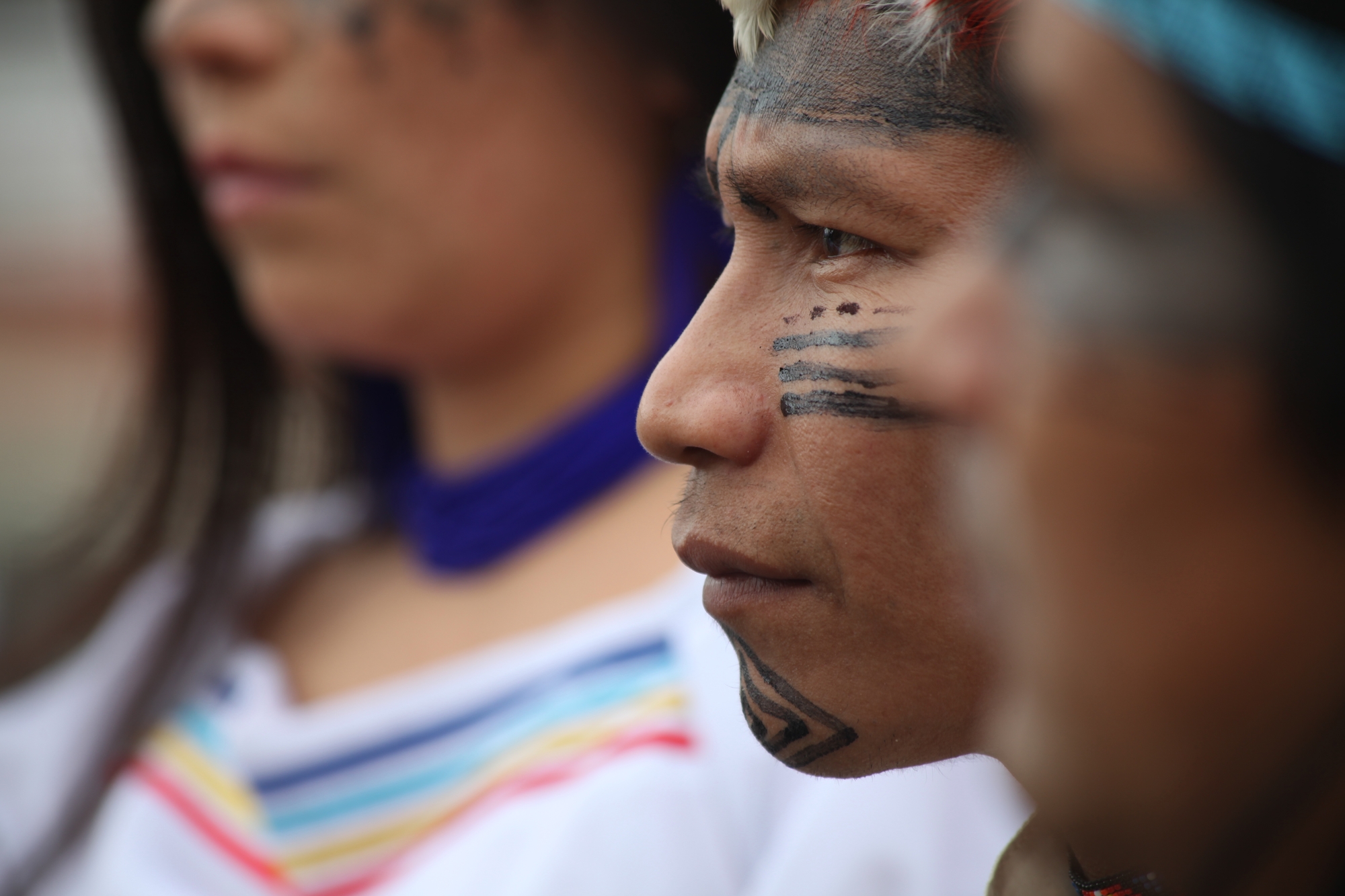 Close up of man with Indigenous paint on face