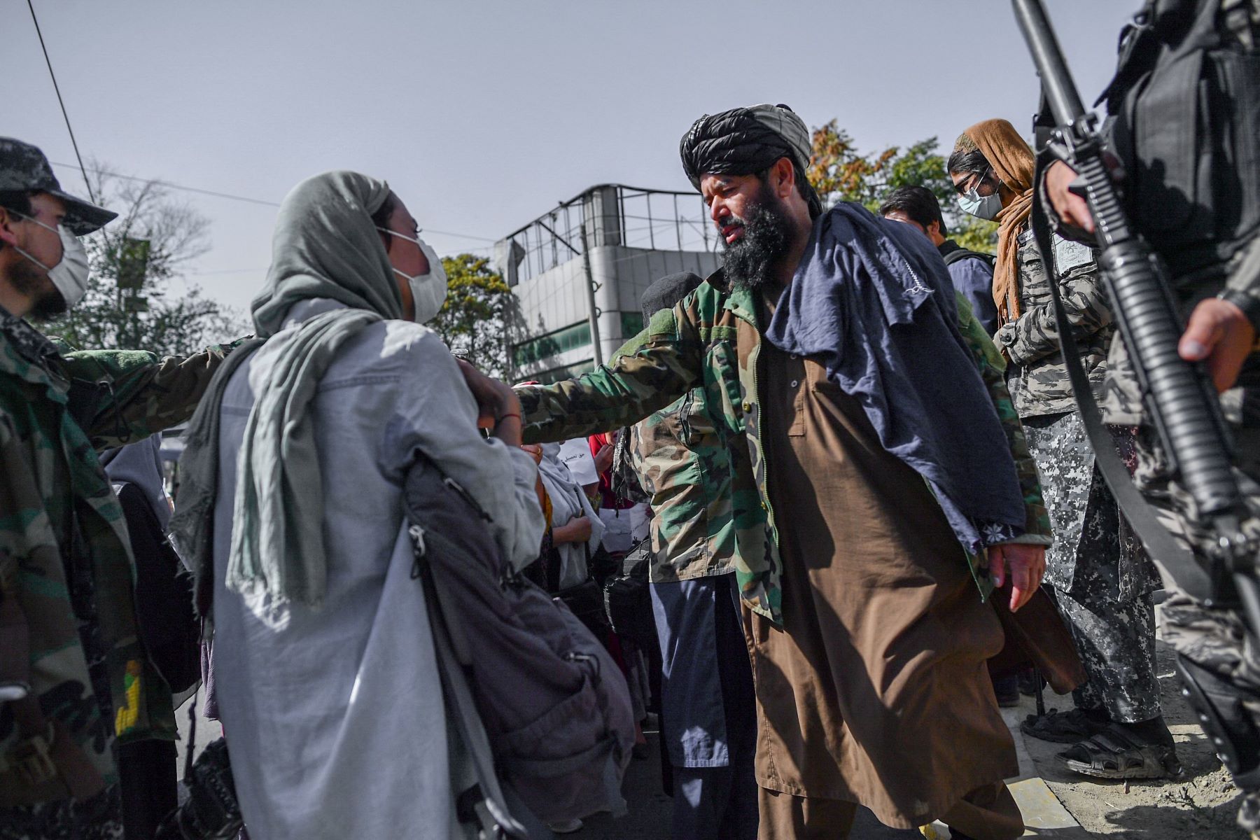Taliban members stop women protesting for women's rights in Kabul on October 21, 2021. Photo by BULENT KILIC/AFP via Getty Images.
