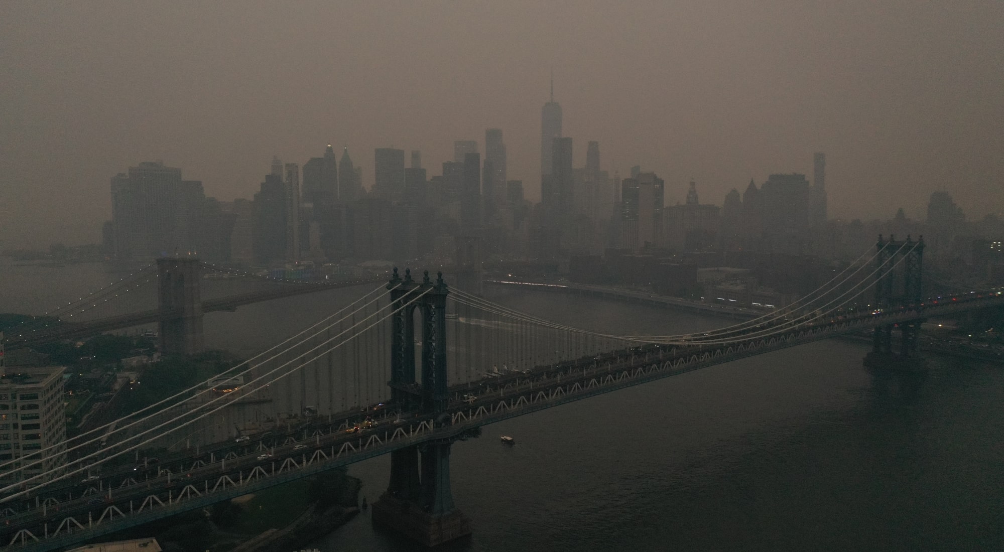 NEW YORK, US - JUNE 06: The Downtown Manhattan skyline stands shrouded in a reddish haze as a result of Canadian wildfires on June 06, 2023 in New York City. Over 100 wildfires are burning in the Canadian province of Nova Scotia and Quebec resulting in air quality health alerts for the Adirondacks, Eastern Lake Ontario, Central New York and Western New York. (Photo by Lokman Vural Elibol/Anadolu Agency via Getty Images)