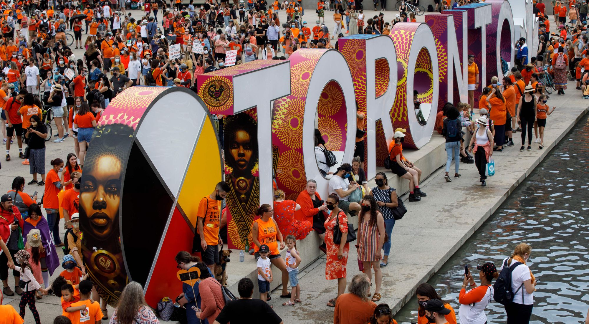 Toronto sign with a crowd in the theme of National Truth and Reconciliation day