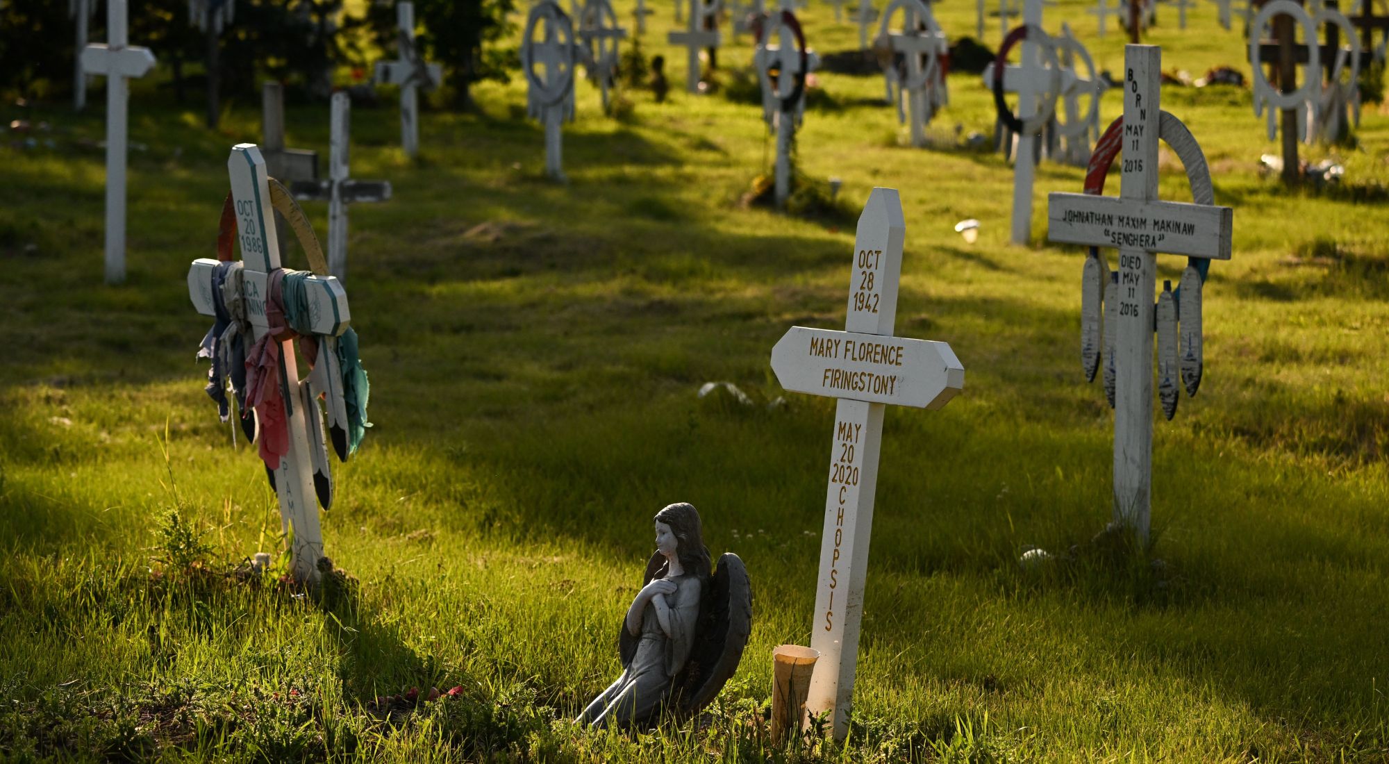 This photograph taken on July 23, 2022, shows crosses marking graves at the Ermineskin Cemetery near the site of the Ermineskin Residential School in Maskwacis, Alberta, on July 23, 2022, ahead of Pope Francis' visit to Canada. - Pope Francis is expected to offer an apology to Indigenous peoples for more than a century of abuses at state schools run by the church in Canada. (Photo by Patrick T. FALLON / AFP) (Photo by PATRICK T. FALLON/AFP via Getty Images)