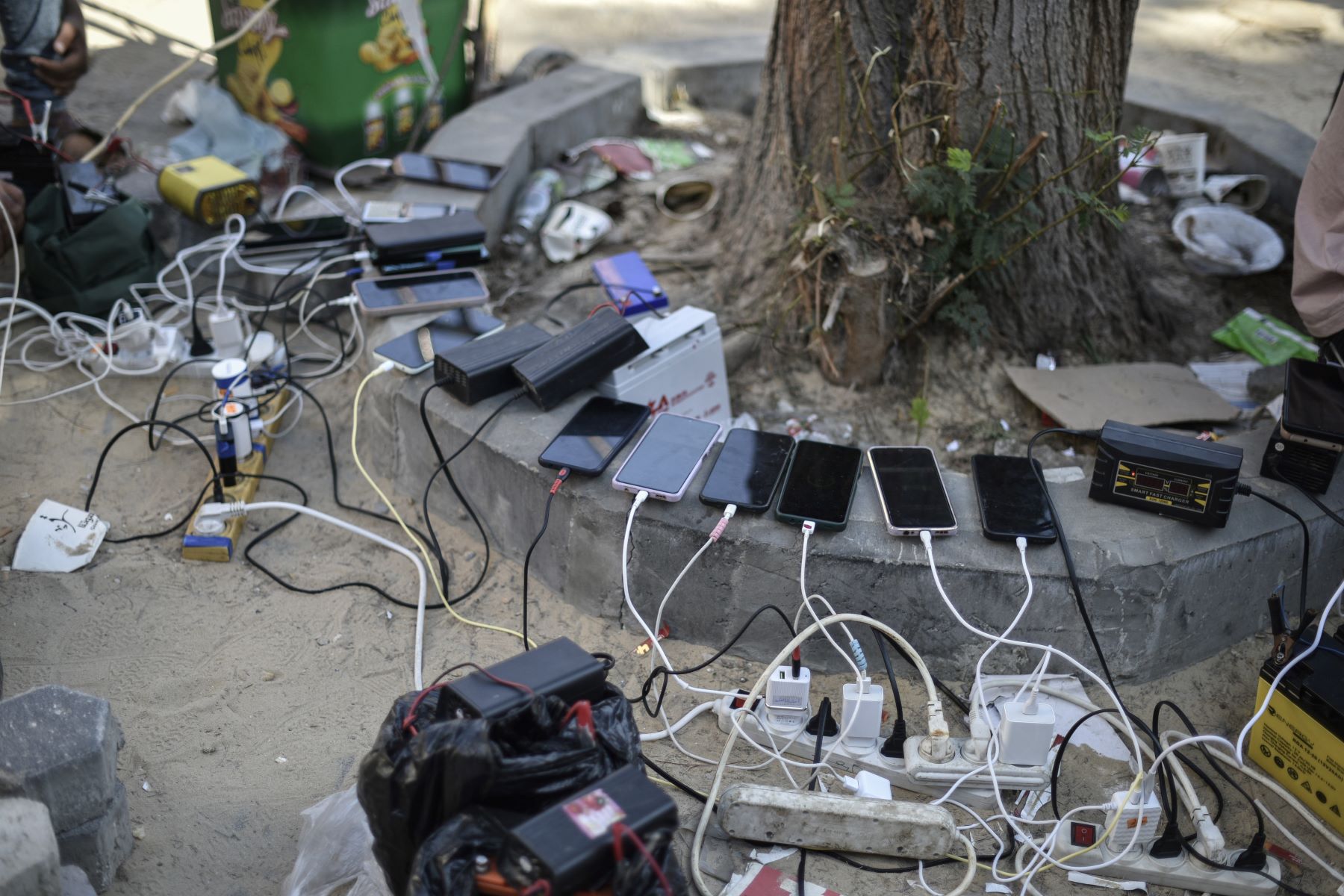 Social media companies must step up crisis response on Israel-Palestine as online hate and censorship proliferate. An image of phones being charged by portable charging stations at Palestinian Red Crescent center as people experience electricity shortages after Israeli attacks in Khan Yunis, Gaza on October 20, 2023. Photo by Abed Zagout/Anadolu via Getty Images.