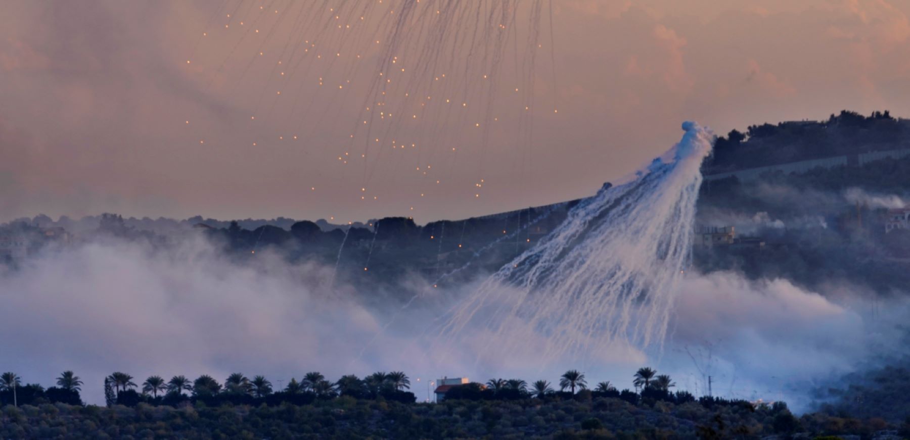 A shell from Israeli artillery explodes over Dahaira, a Lebanese border village with Israel, south Lebanon, Monday, Oct. 16, 2023. Lebanon’s militant Hezbollah group says its fighters have targeted five Israeli posts along the border in the country’s south. (AP Photo/Hussein Malla)