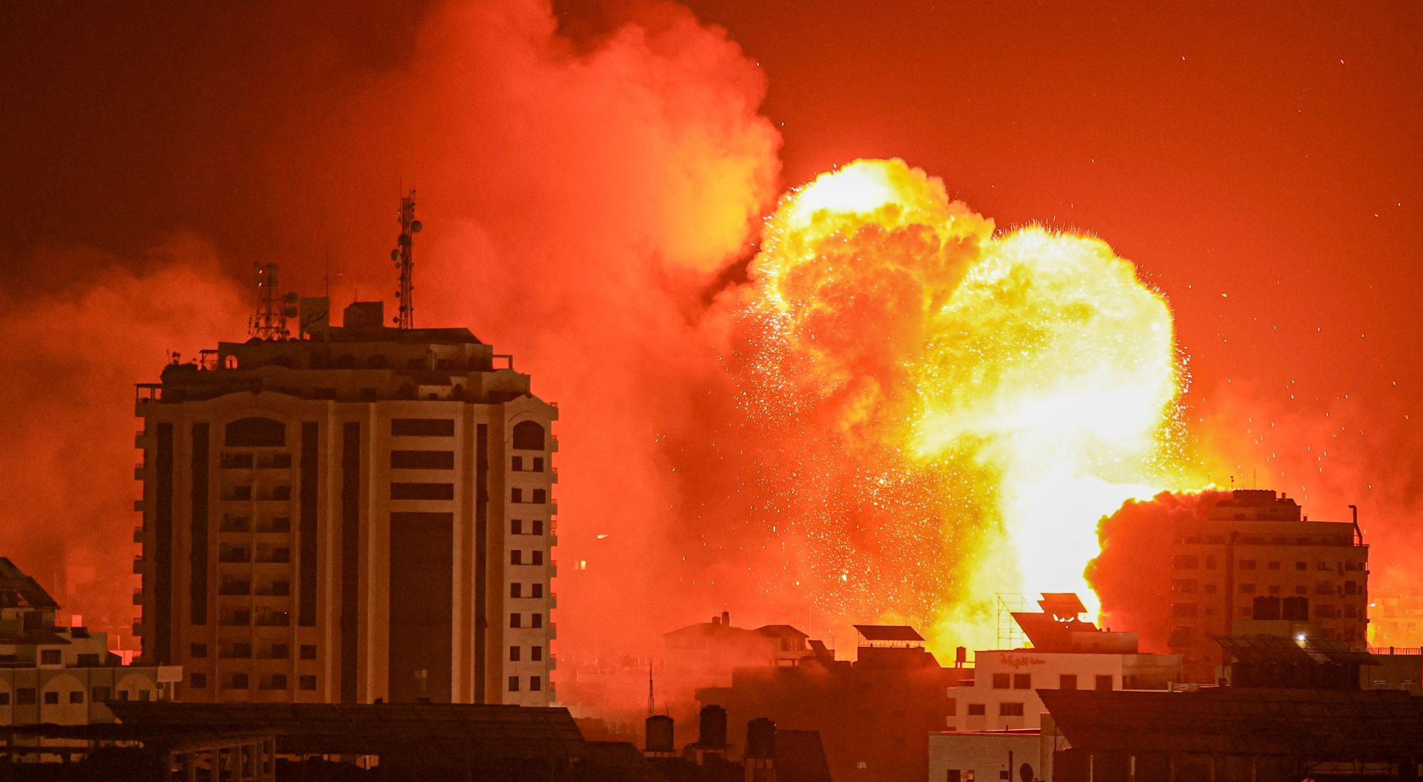 A fireball erupts from an Israeli airstrike in Gaza City on October 9, 2023. Photo by MAHMUD HAMS/AFP via Getty Images.