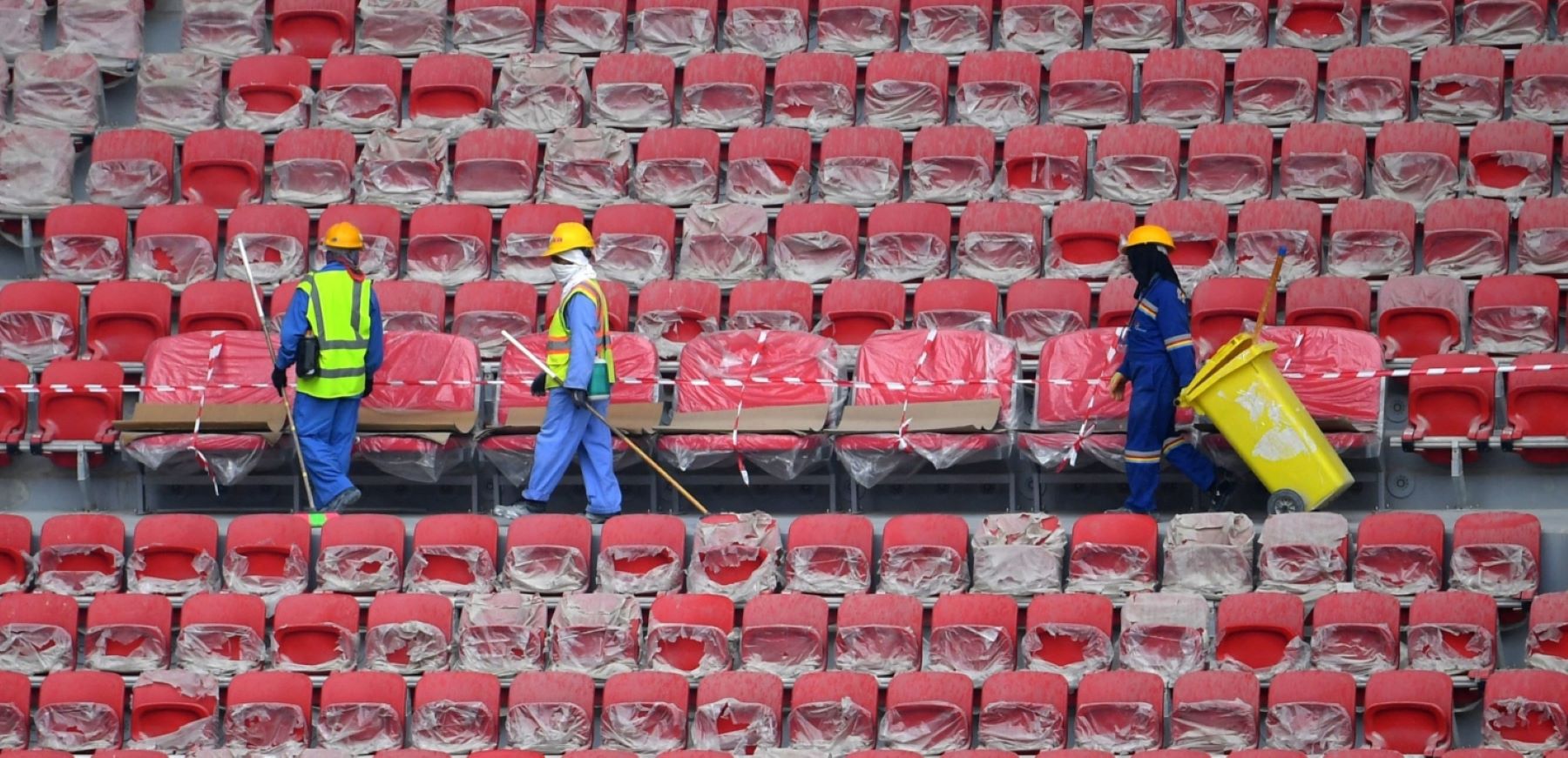 December 17, 2019: construction workers at the stands of Qatar's new al-Bayt Stadium in the capital Doha, which will host matches of the FIFA football World Cup 2022. Photo by GIUSEPPE CACACE/AFP via Getty Images