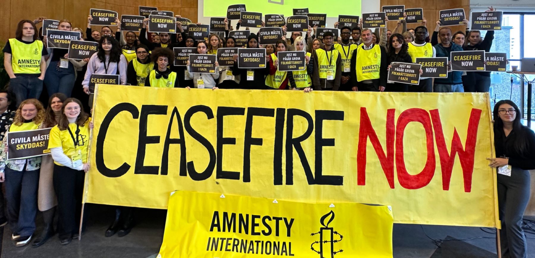 Amnesty International Sweden activists call for a ceasefire by all parties in Israel and the occupied Gaza Strip