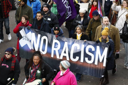 GLASGOW, SCOTLAND - NOVEMBER 25: Scottish Labour leader Anas Sarwar (2nd, L) joins people as they take part in a St Andrew's Day anti-racism and anti-fascism rally on November 25, 2023 in Glasgow, Scotland. Trade unions and community activists march together to protest against the Far Right in Scotland and their attempts to capitalise on what they see as the UK Government's unwelcome approach to asylum and anti-refugee rhetoric. (Photo by Jeff J Mitchell/Getty Images)