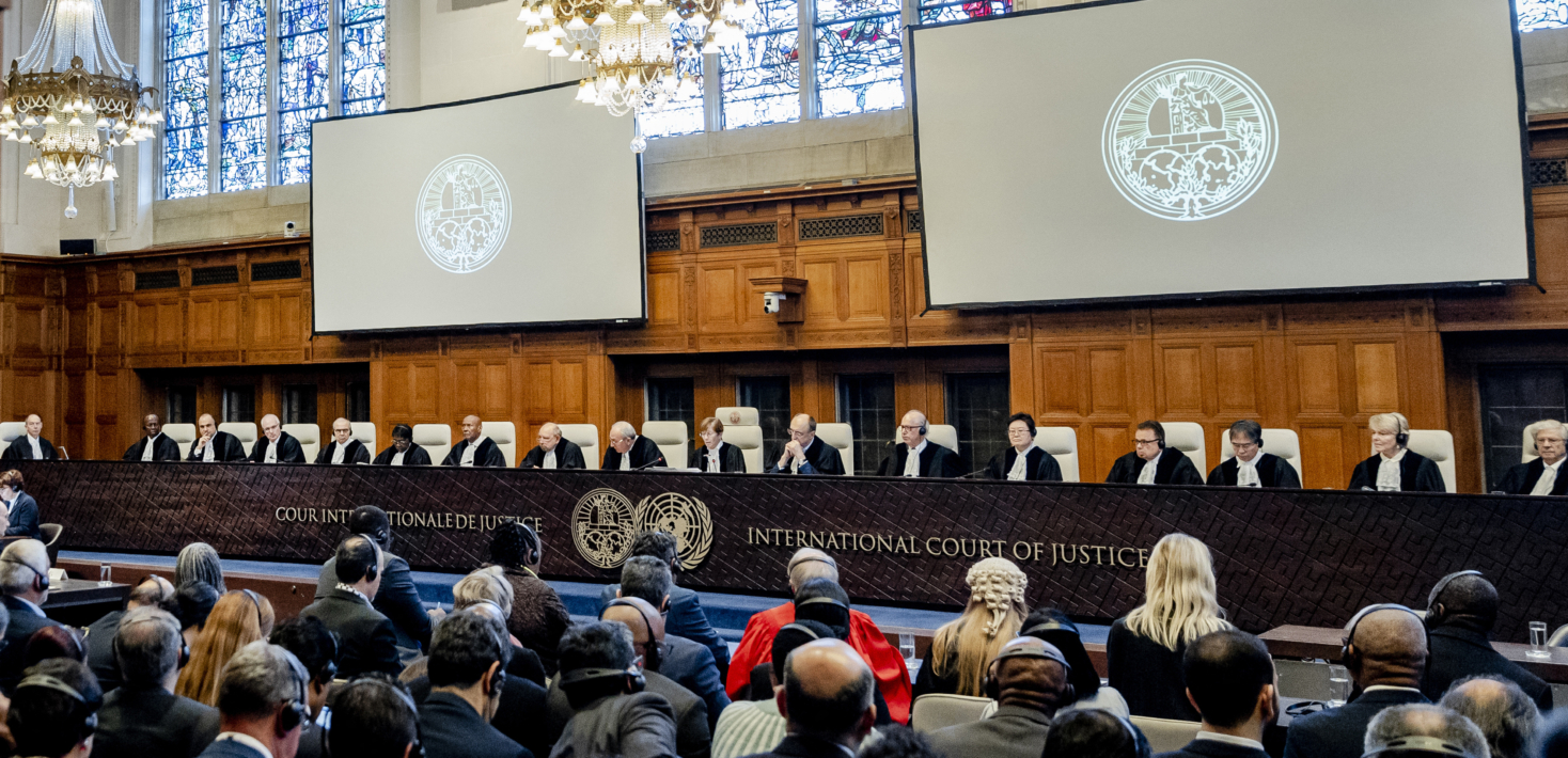 "ICJ President Joan Donoghue (C) speaks at the International Court of Justice (ICJ) prior to the verdict announcement in the genocide case against Israel, brought by South Africa, in The Hague on January 26, 2024. The UN top court on January 26, 2024 ordered Israel to allow humanitarian access in Gaza, handing down a landmark decision in a case that has drawn global attention. Israel must take "immediate and effective measures to enable the provision of urgently needed basic services and humanitarian assistance to address the adverse conditions of life faced by Palestinians," ruled the court in its highly anticipated verdict."
