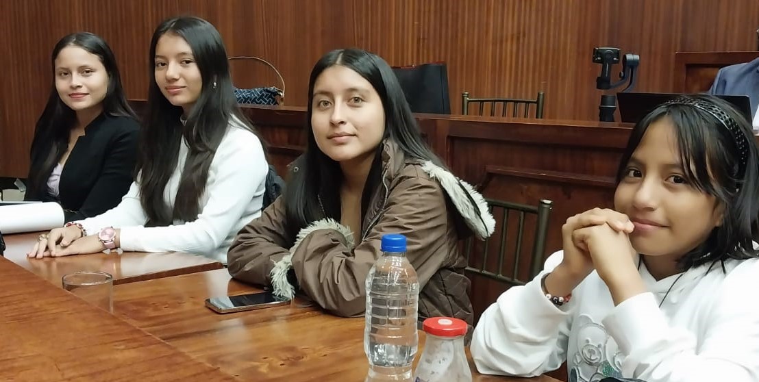 Four young girls looking into the camera