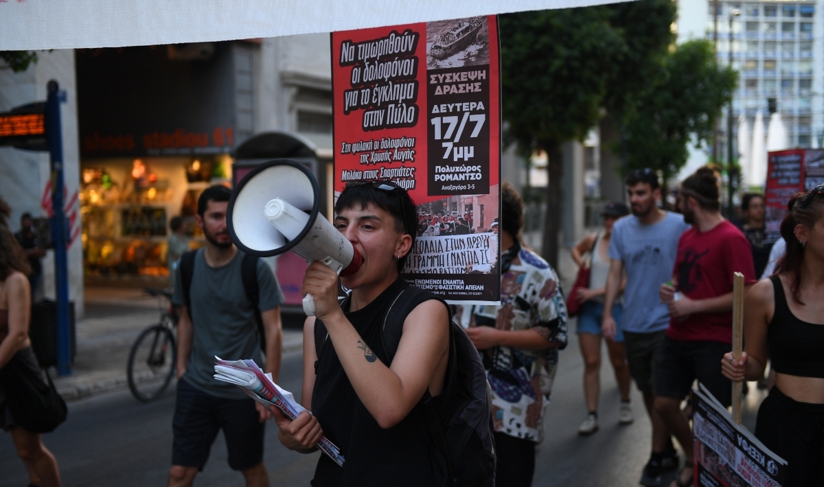 People carry banners and protest against the Pylos migrant ship crash in Athens, Greece on July 13, 2023. (Photo by Dimitris Lampropoulos/Anadolu Agency via Getty Images)