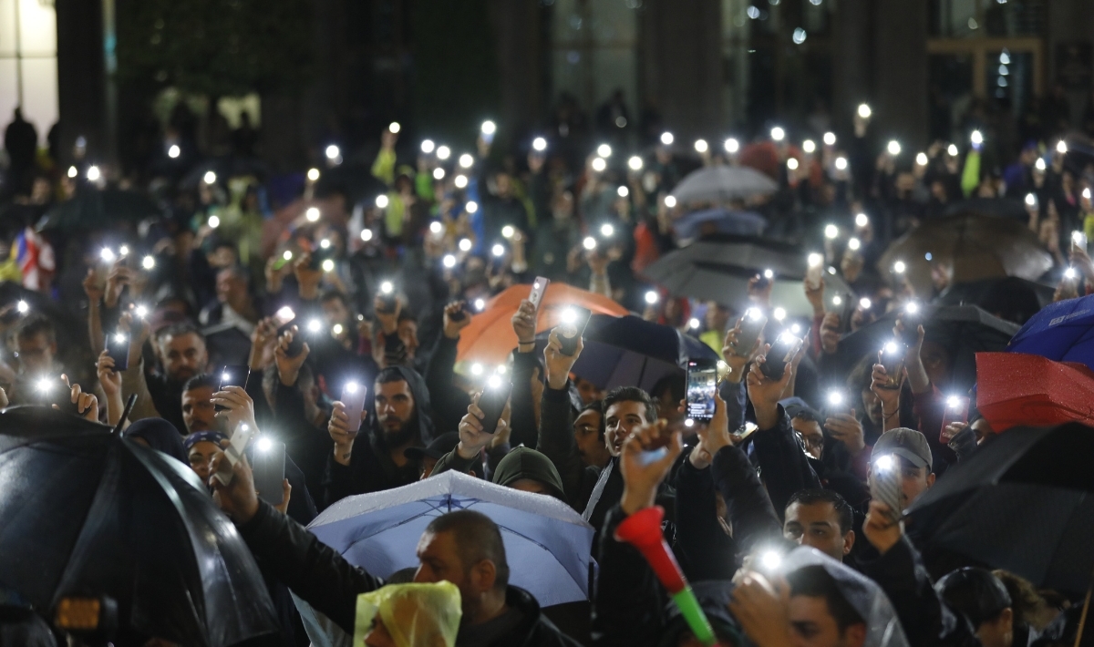 eople gather to protest after Russian passenger plane landed in Tbilisi, Georgia, completing the first direct flight from Moscow to Tbilisi after a four-year hiatus, on May 20, 2023. Demonstrators unfurled flags of Georgia, Ukraine, the European Union (EU) and carried anti-Russian banners. (Photo by Mirian Meladze/Anadolu Agency via Getty Images)