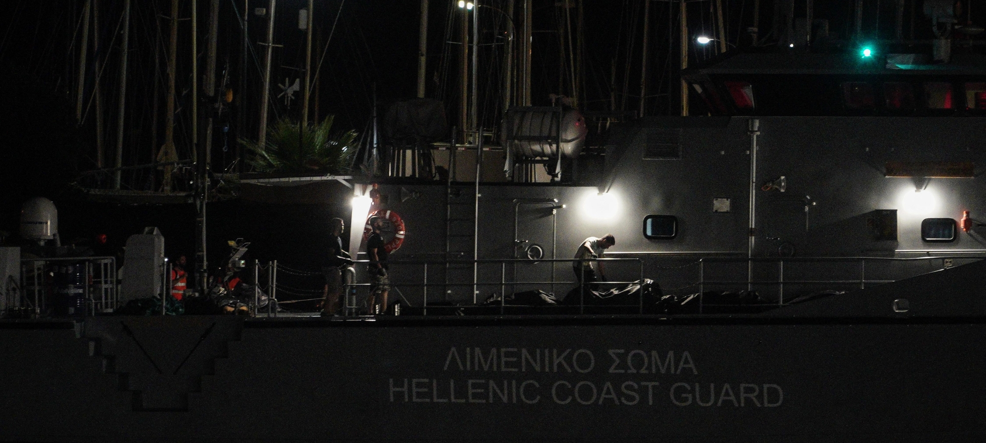 Greek Coast Guard ship carrying the bodies of migrants and refugees who died when their overcrowded trawler sank off the coast of Pylos, Greece on Jun 14, 2023. (Photo by Konstantinos Zilos/NurPhoto via Getty Images)