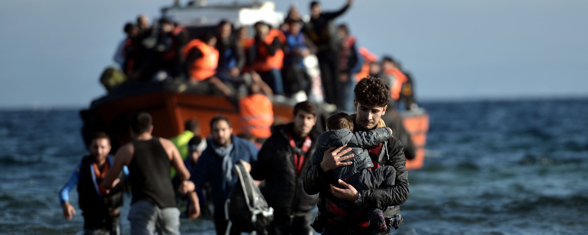 Refugees and migrants arrive on the Greek island Lesbos after crossing the Aegean Sea from Turkey on November 7, 2015. Photo by Aris Messinis/AFP via Getty Images.