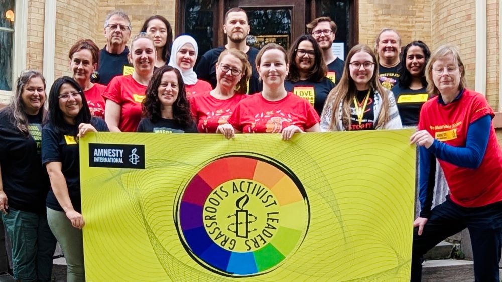 Group photo of Grassroots Activist Leaders with flag