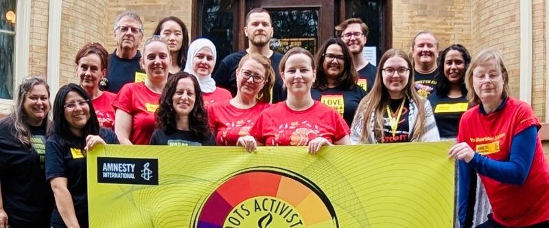 Group photo of Grassroots Activist Leaders with flag