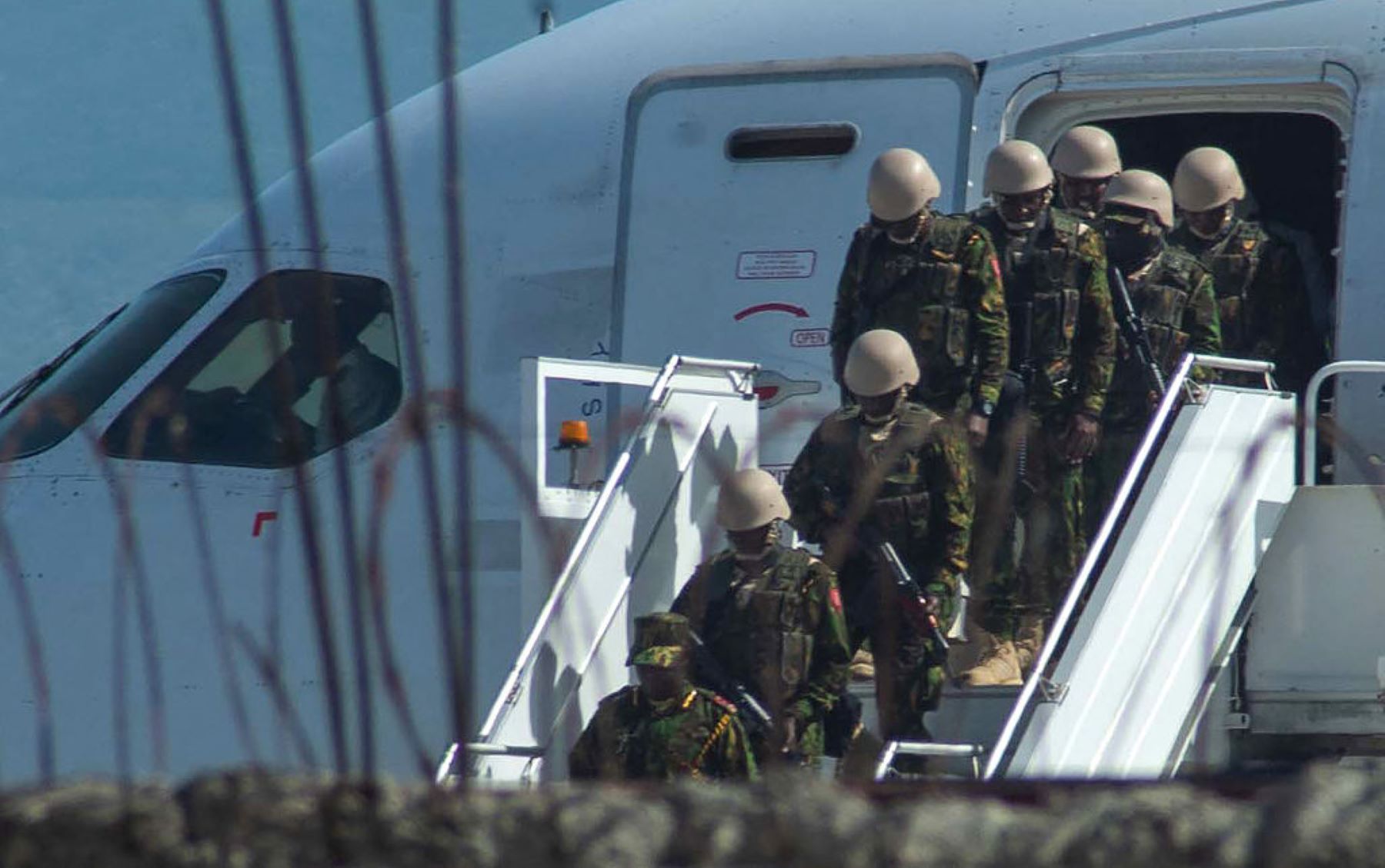 Kenyan security forces arrive at Toussaint Louverture International Airport in Port-au-Prince on June 25, 2024. The Kenyan forces begin a high-stakes mission to restore order in the Western Hemisphere's poorest nation. Photo by CLARENS SIFFROY/AFP via Getty Images.