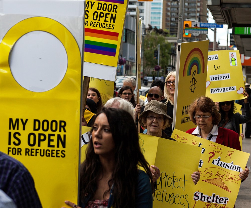 People march during World Refugee Day