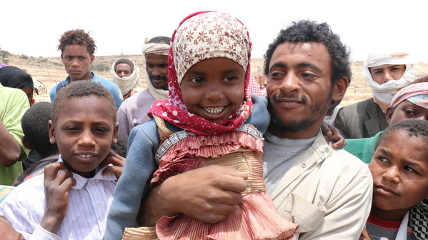 Man with daughter and other kids smiling happy