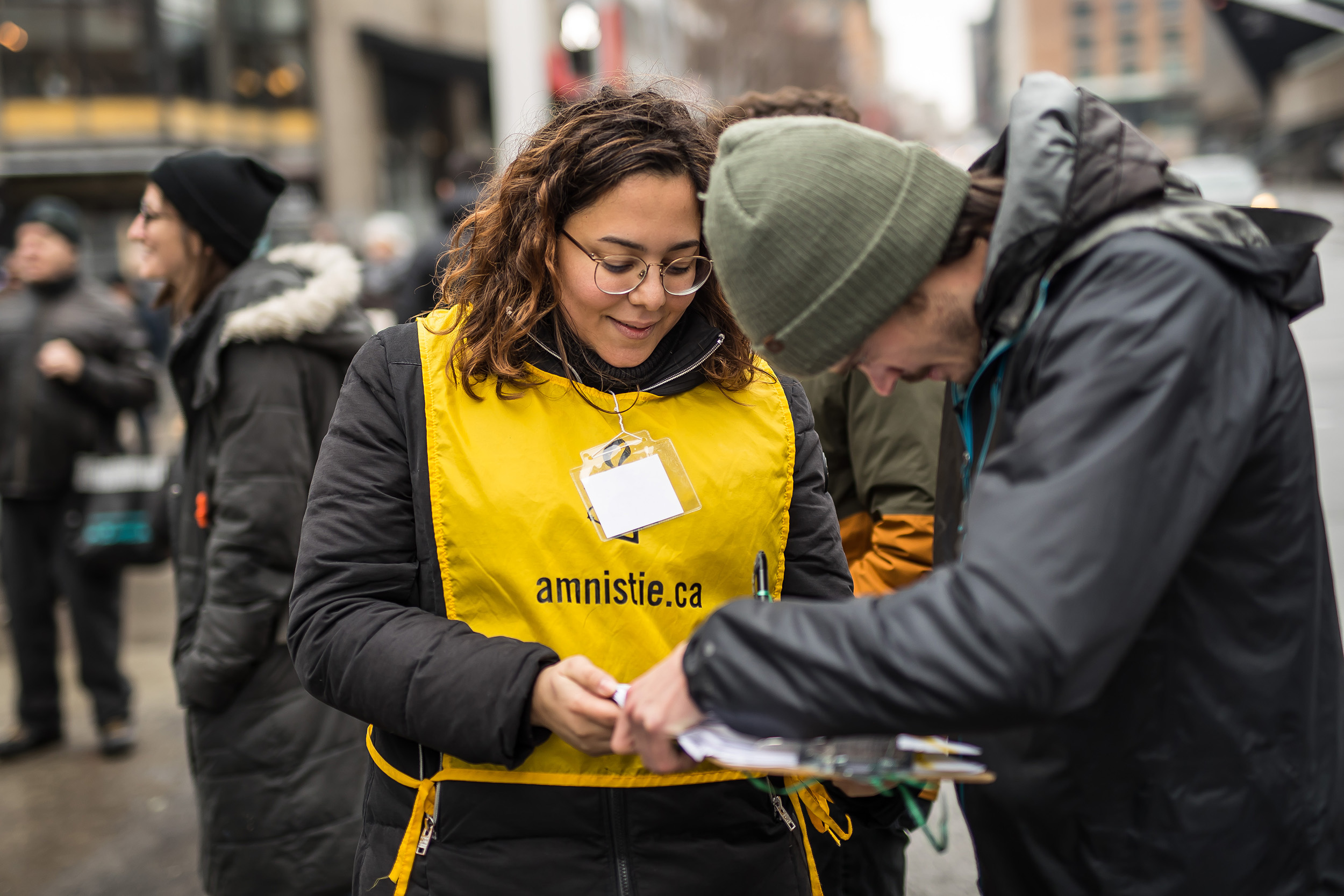 An Amnesty volunteer getting a petition signed