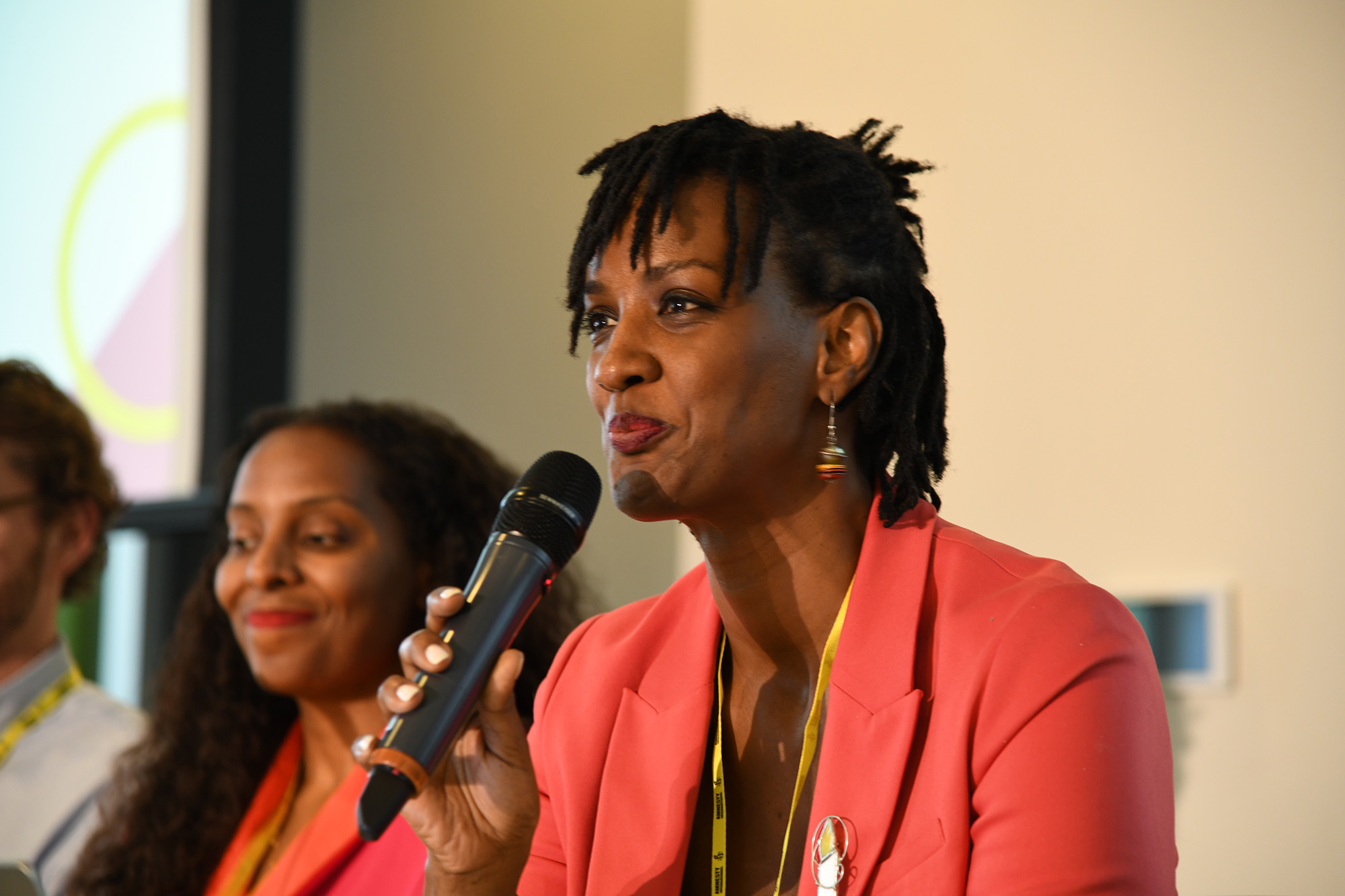 Ketty Nivyabandi at a press conference speaking into a microphone