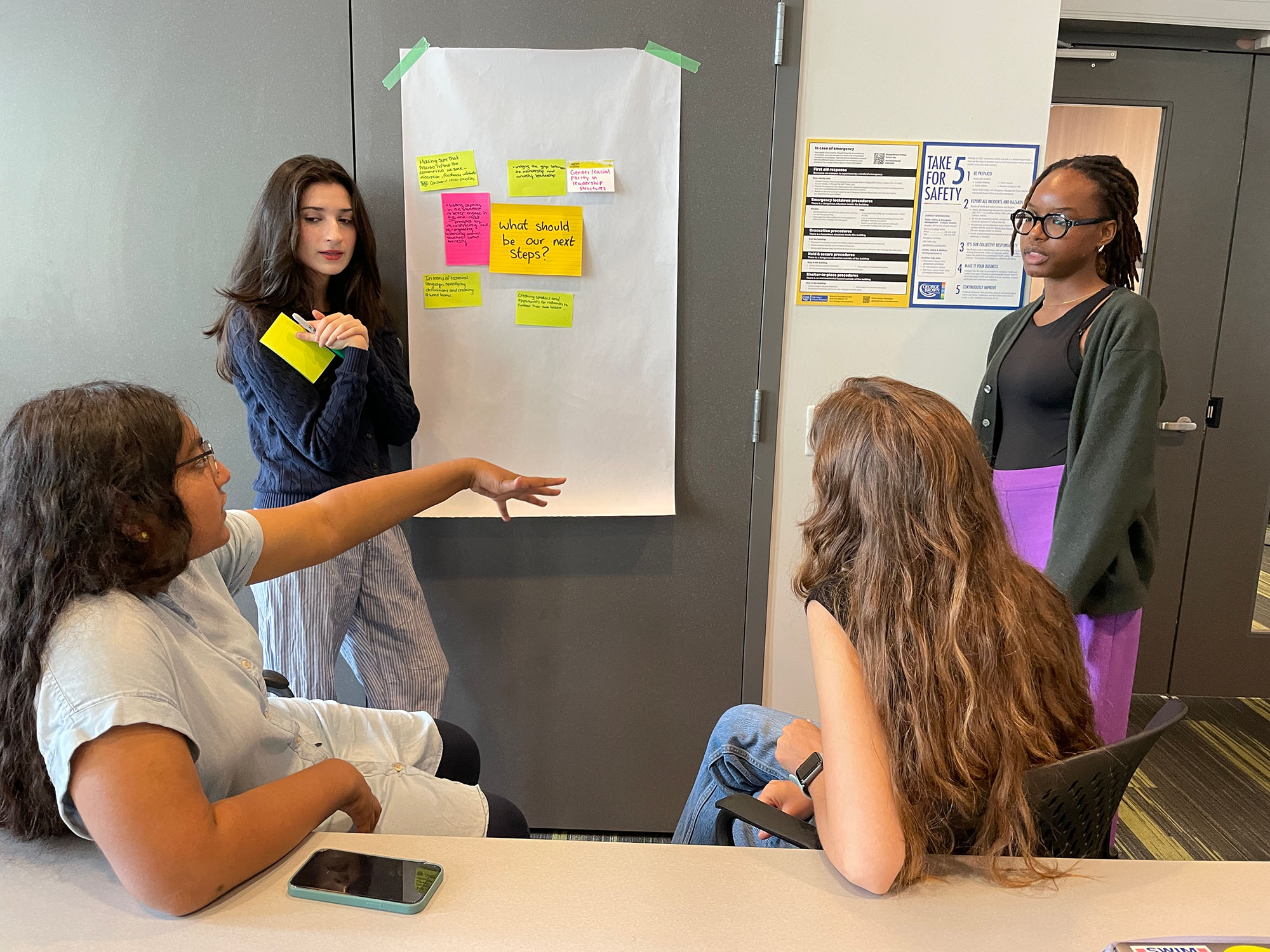 A group of students chatting in a group discussion