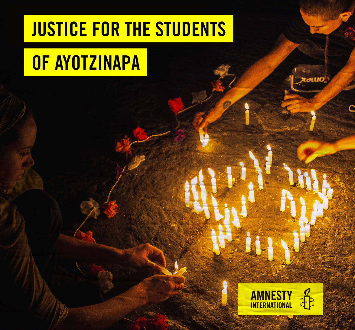 Students lighting candles and setting them up in the shape of the number 43