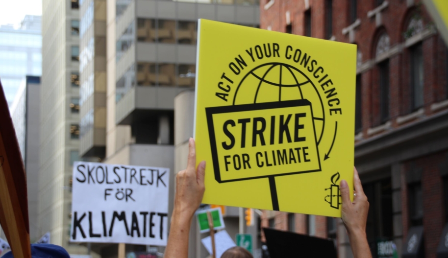 sign that reads Strike for Climate