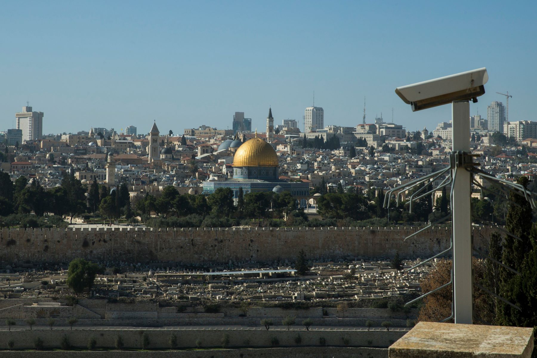 The Dome of the Rock and the old city are seen from the Mount of Olives aside a security camera in Jerusalem on January 13, 2018. (Photo by Emmanuele Contini/NurPhoto via Getty Images)