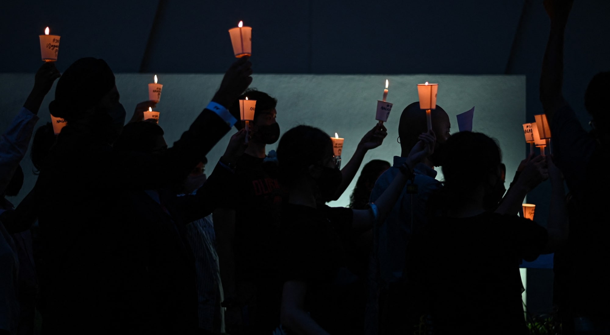 Activists attend a candlelight vigil against the impending execution of Nagaenthran K. Dharmalingam, sentenced to death for trafficking heroin into Singapore, outside the Singaporean embassy in Kuala Lumpur on November 8, 2021. (Photo by Mohd RASFAN / AFP) (Photo by MOHD RASFAN/AFP via Getty Images)
