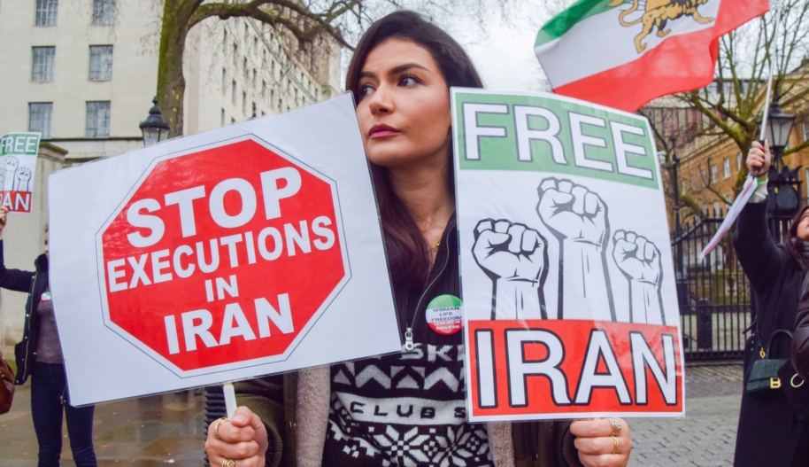 A protester holds 'Stop executions in Iran' and 'Free Iran' placards during the demonstration in London, on January 14, 2023. Demonstrators gathered outside Downing Street in protest against executions in Iran and in support of freedom for Iran. (Photo by Vuk Valcic/SOPA Images/LightRocket via Getty Images)