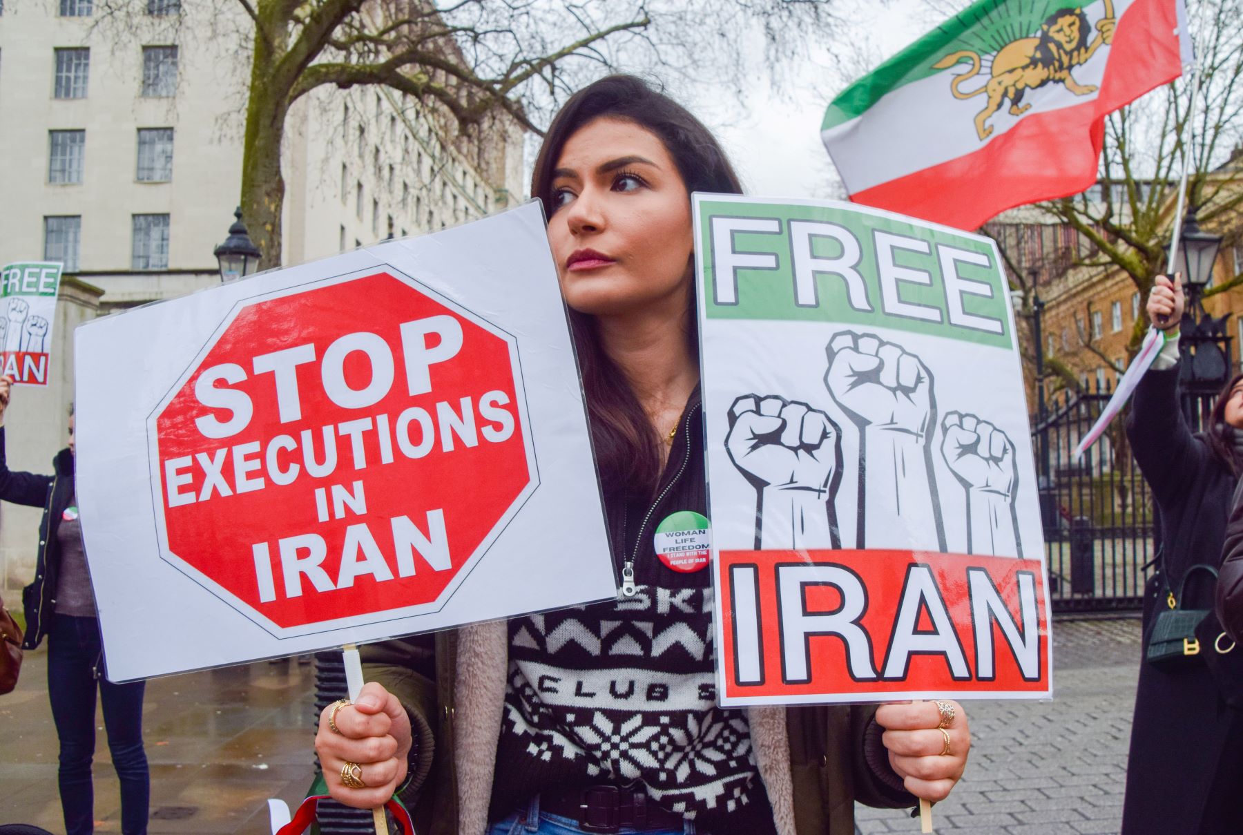 A protester holds 'Stop executions in Iran' and 'Free Iran' placards during the demonstration in London, on January 14, 2023. Demonstrators gathered outside Downing Street in protest against executions in Iran and in support of freedom for Iran. (Photo by Vuk Valcic/SOPA Images/LightRocket via Getty Images)