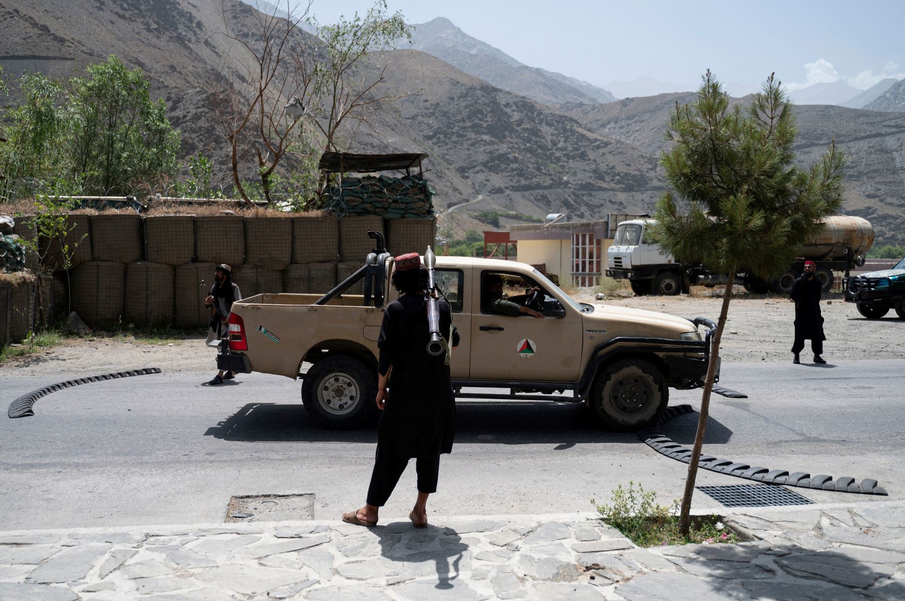July 8, 2022, a Taliban fighter holds a rocket-propelled grenade (RPG) at a road checkpoint near the Bazarak district in Panjshir Province. (Photo by Wakil KOHSAR / AFP) (Photo by WAKIL KOHSAR/AFP via Getty Images)