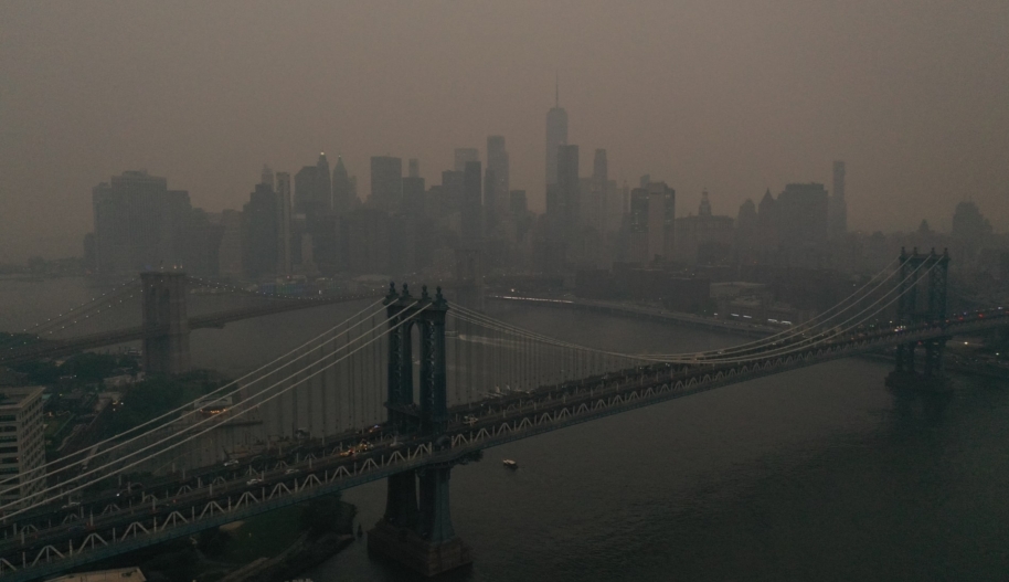 NEW YORK, US - JUNE 06: The Downtown Manhattan skyline stands shrouded in a reddish haze as a result of Canadian wildfires on June 06, 2023 in New York City. Over 100 wildfires are burning in the Canadian province of Nova Scotia and Quebec resulting in air quality health alerts for the Adirondacks, Eastern Lake Ontario, Central New York and Western New York. (Photo by Lokman Vural Elibol/Anadolu Agency via Getty Images)