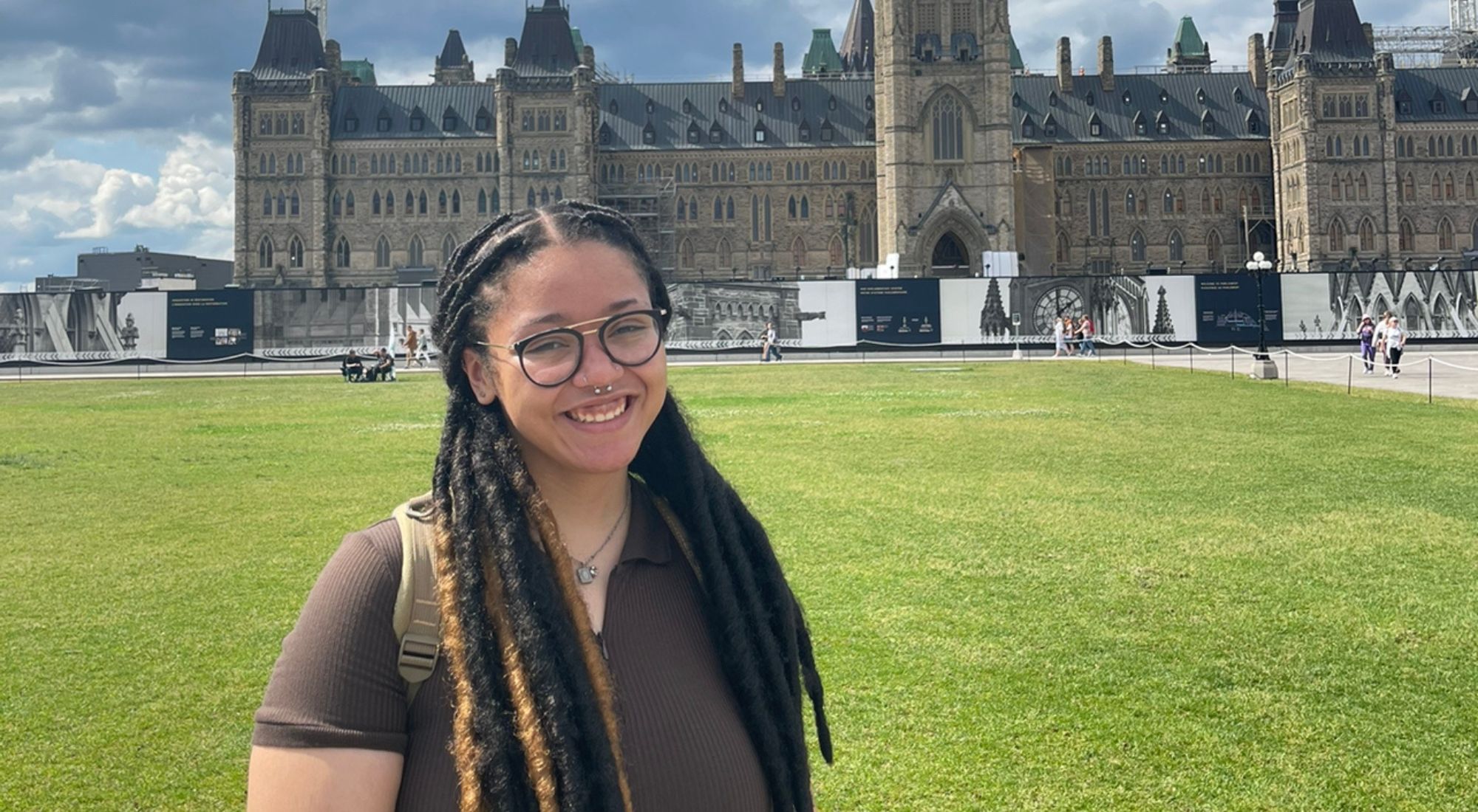Jasmin Smith standing in front of Parliament Hill in Ottawa