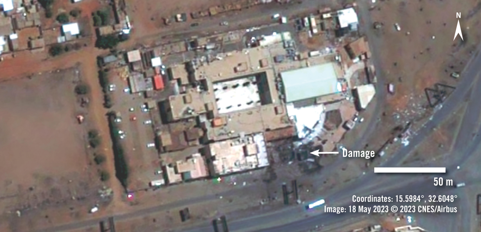 A satellite image of a hospital complex in Sudan showing damage to one or more of the buildings