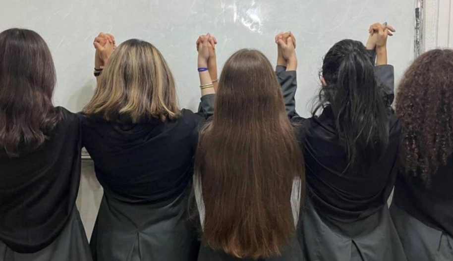 Schoolgirls in Iran have also participated through peaceful protests, including by removing their mandatory hijabs (compulsory veiling) while in their school uniforms. (c) private