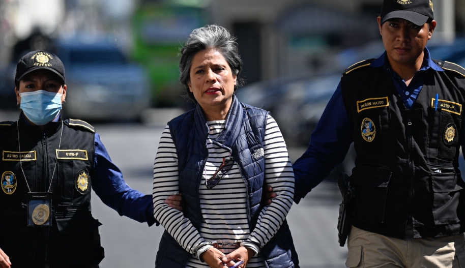 Guatemalan former lawyer of the International Commission against Impunity in Guatemala (CICIG), Claudia Gonzalez (C), arrives handcuffed to a hearing at the Justice Palace after being arrested at her house in Guatemala City, on August 28, 2023.
