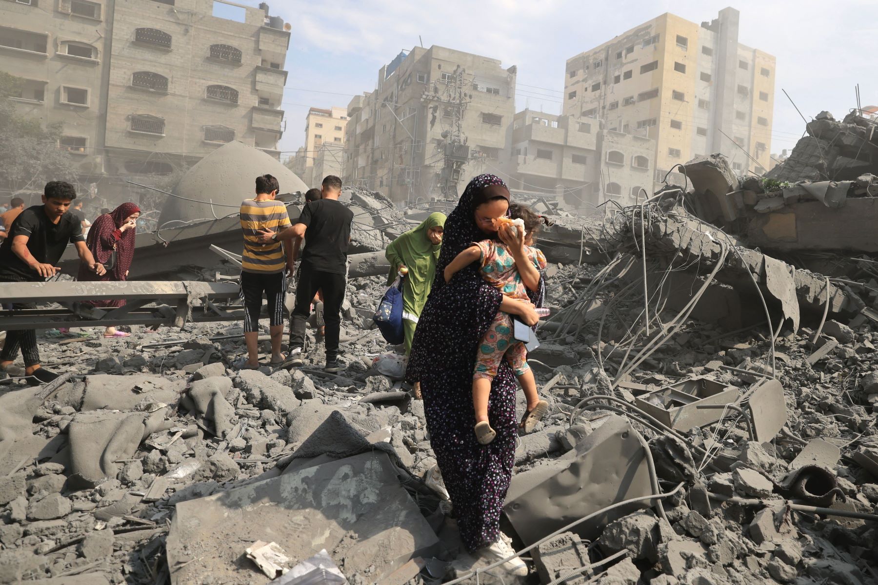 States must call for an immediate ceasefire at Paris Humanitarian Conference to ensure safe delivery of aid in Gaza' > Palestinians evacuate the area following an Israeli airstrike on the Sousi mosque in Gaza City on October 9, 2023. (Photo by MAHMUD HAMS/AFP via Getty Images)