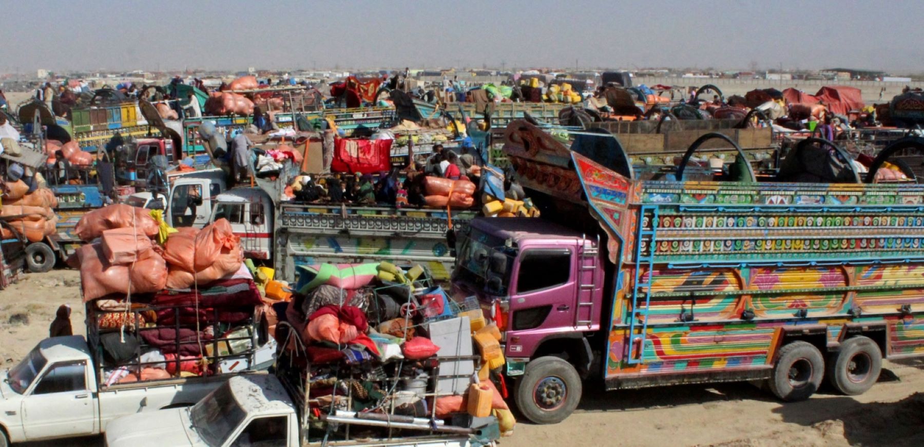 Afghan refugees arrive in trucks to cross the Pakistan-Afghanistan border in Chaman on October 31, 2023. More than 10,000 Afghans living in Pakistan rushed to the borders on October 31, just hours before a deadline for 1.7 million people to leave Pakistan voluntarily or face arrest and deportation. (Photo by ABDUL BASIT/AFP via Getty Images)