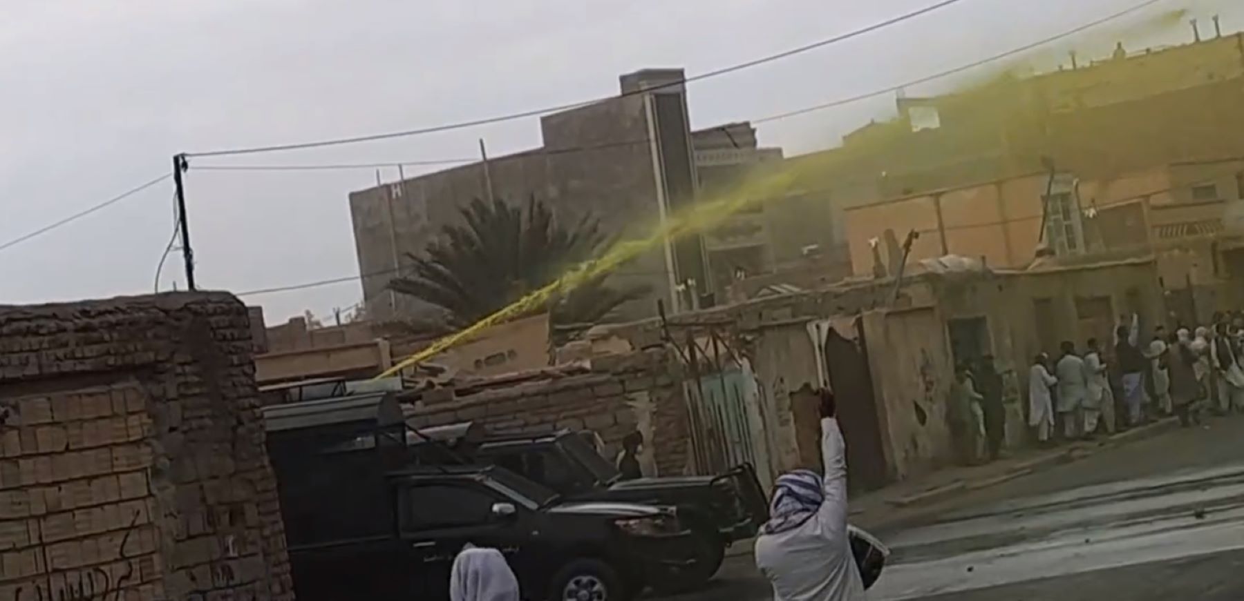 New wave of brutal attacks against Baluchi protesters and worshippers. An image provided by an eyewitness on Friday 20 October 2023 shows a water cannon spraying yellow liquid to disperse protests and facilitate subsequent arrest of marked protesters. ©private