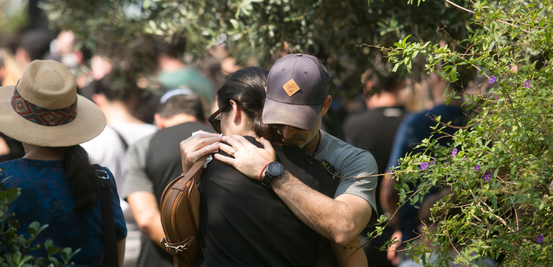 Family and friends of May Naim, 24, who was murdered by Palestinians militants at the "Supernova" festival, near the Israeli border with Gaza strip, react during her funeral on October 11, 2023 in Gan Haim, Israel. Israel has sealed off Gaza and conducted airstrikes on Palestinian territory after an attack by Hamas killed hundreds and took more than 200 hostages. © Amir Levy/Getty Images