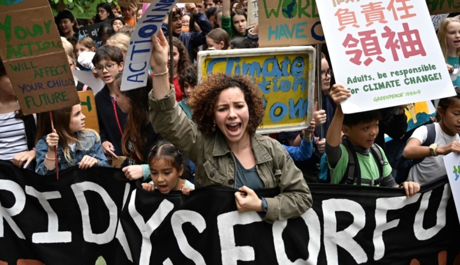 Students take part in a protest against climate change in Hong Kong on March 15, 2019, as part of a global movement called #FridaysForFuture. - Thousands of young people marched through cities in Asia on March 15, kicking off a global day of student protests that aims to spark world leaders into action on climate change. Photo by ANTHONY WALLACE/AFP via Getty Images.