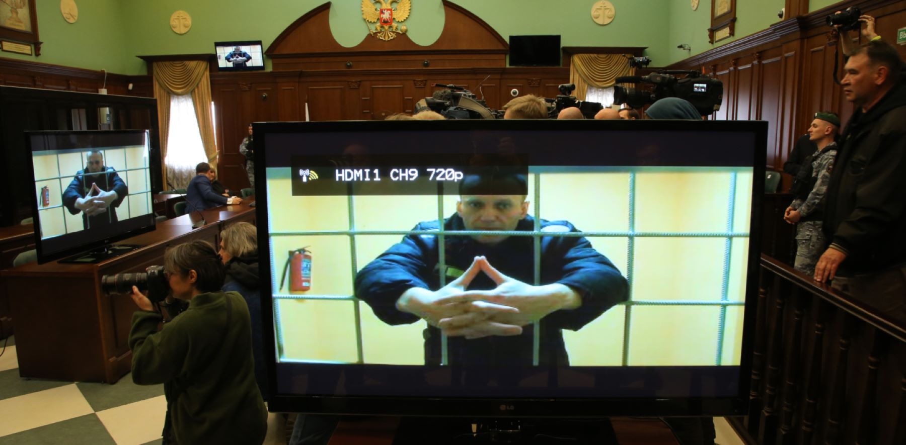 Russian opposition politician, anti-corruption campaigner and founder of the Anti-Corruption Foundation (FBK), Alexey Navalny is seen on the screen during his legal appeal against his nine-year prison sentence, in Moscow's City Court, on May 24, 2022, in Moscow, Russia. Appeal of Kremlin critic Navalny was rejected by the court on Tuesday. (Photo by Contributor/Getty Images)