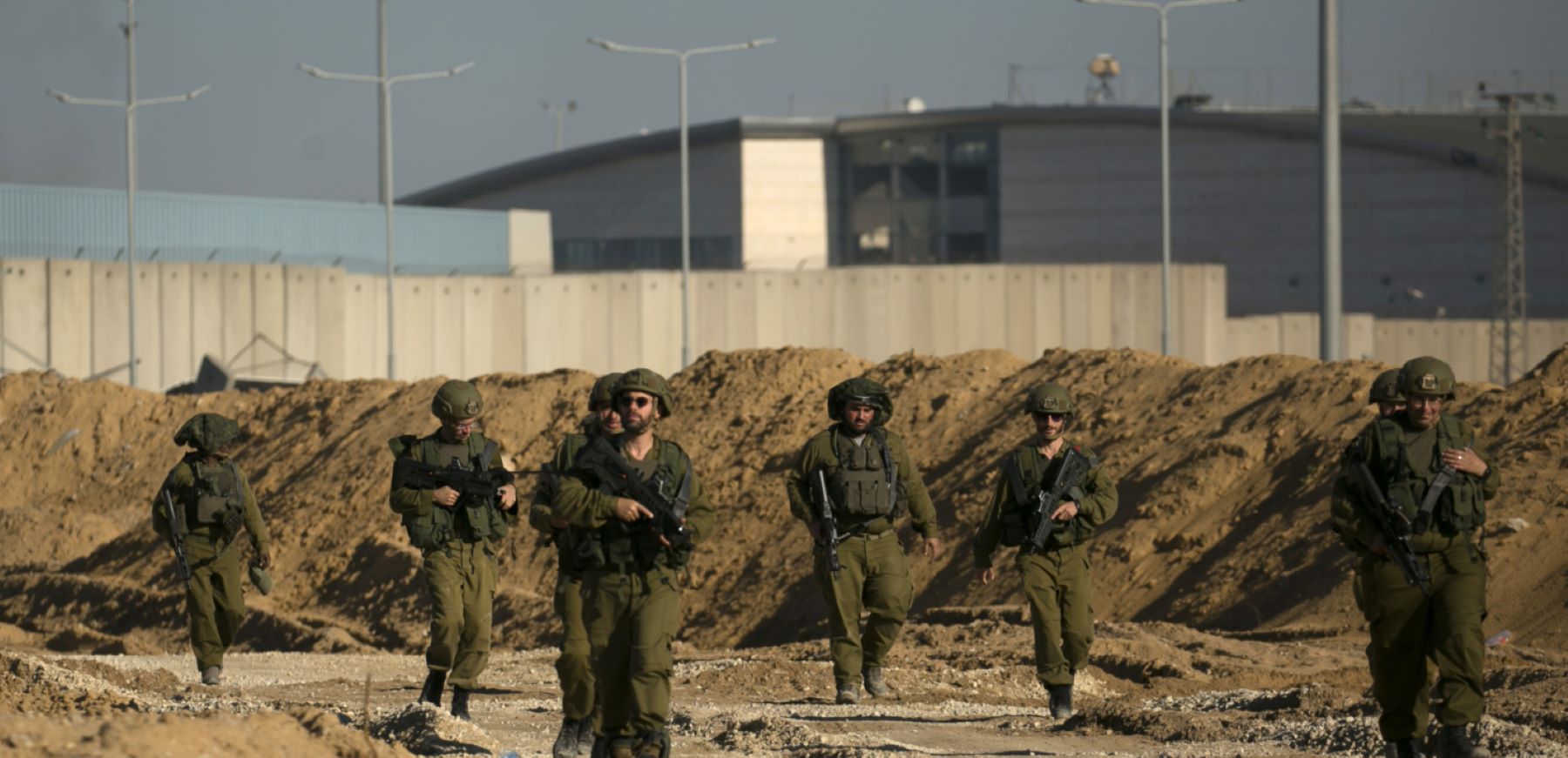Israeli soldiers secure an area near the Erez Crossing, near the border with Israel in the Gaza side of the border on December 15, 2023, northern Gaza Strip. As the IDF have pressed into Gaza as part of their campaign to defeat Hamas, they have highlighted the militant group's extensive tunnel network as emblematic of the way the group embeds itself and its military activity in civilian areas. Photo by Amir Levy/Getty Images