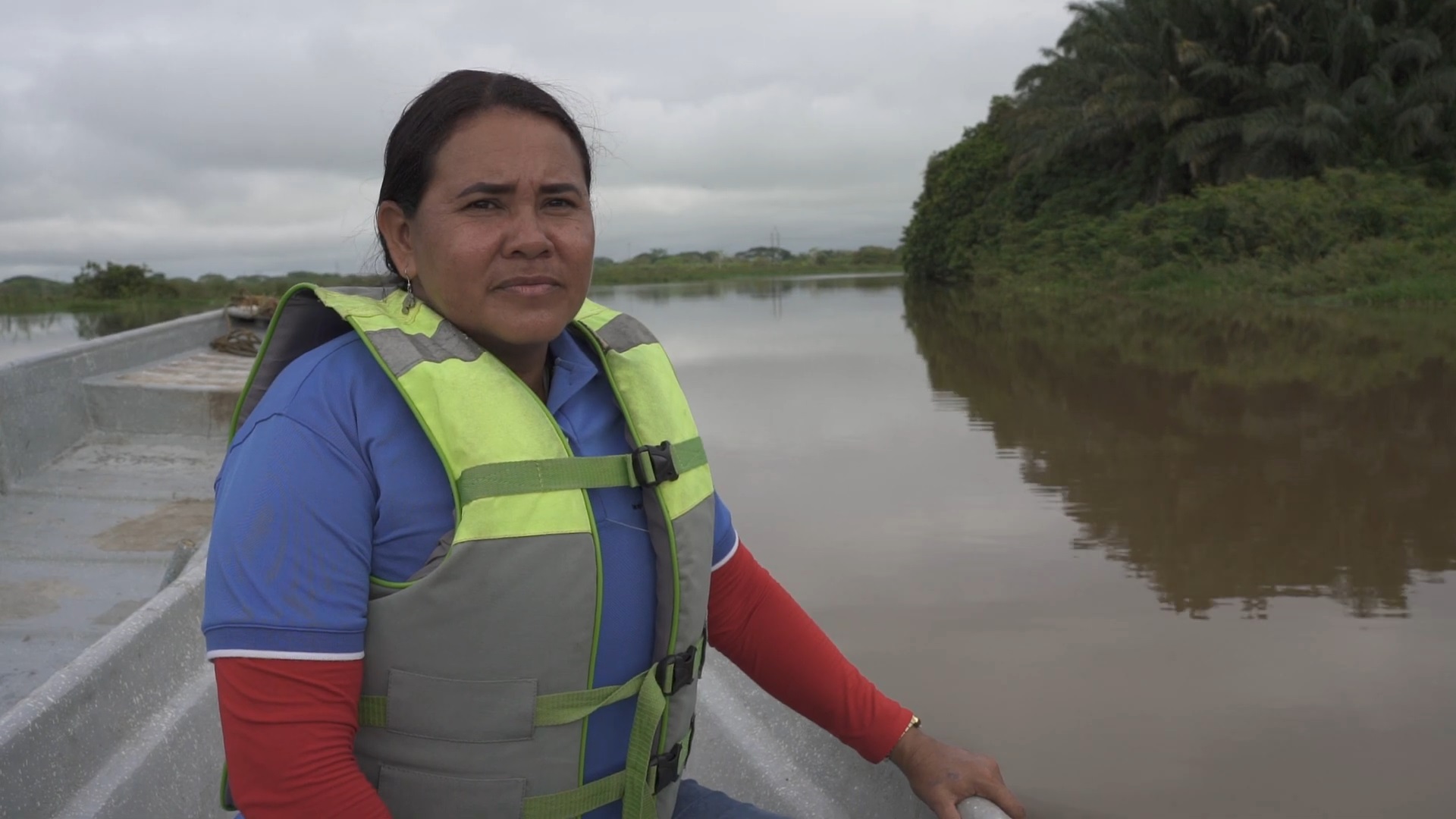 Yuly Velasquez travels in a boat on the river