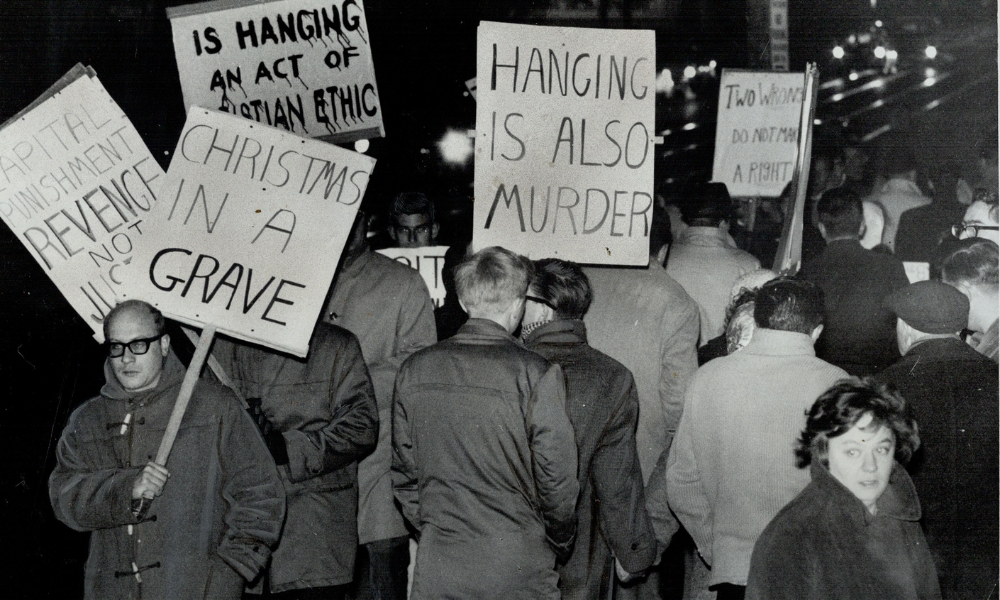 On December 11, 1962, people protest capital punishment outside the Don Jail. (Photo by Barry Philp/Toronto Star via Getty Images)