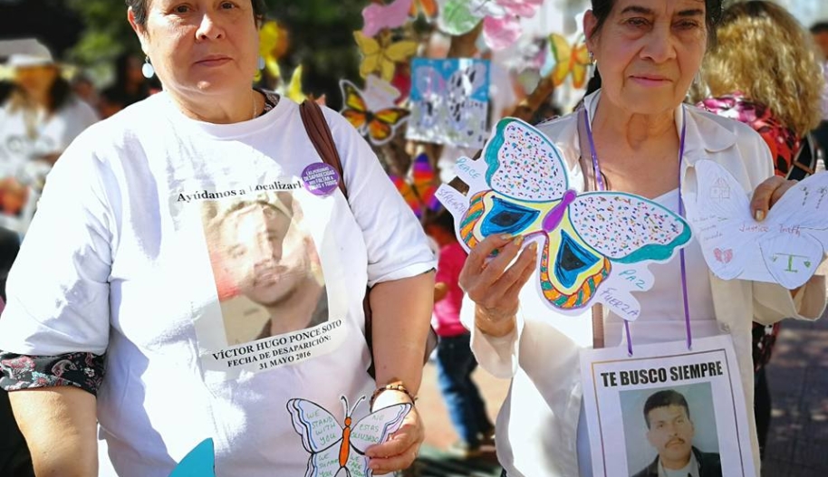 Mothers and sisters of the Disappeared with masks that read "Donde Estan? Where Are They?"